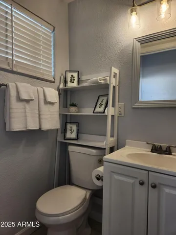 a bathroom with a toilet and a sink