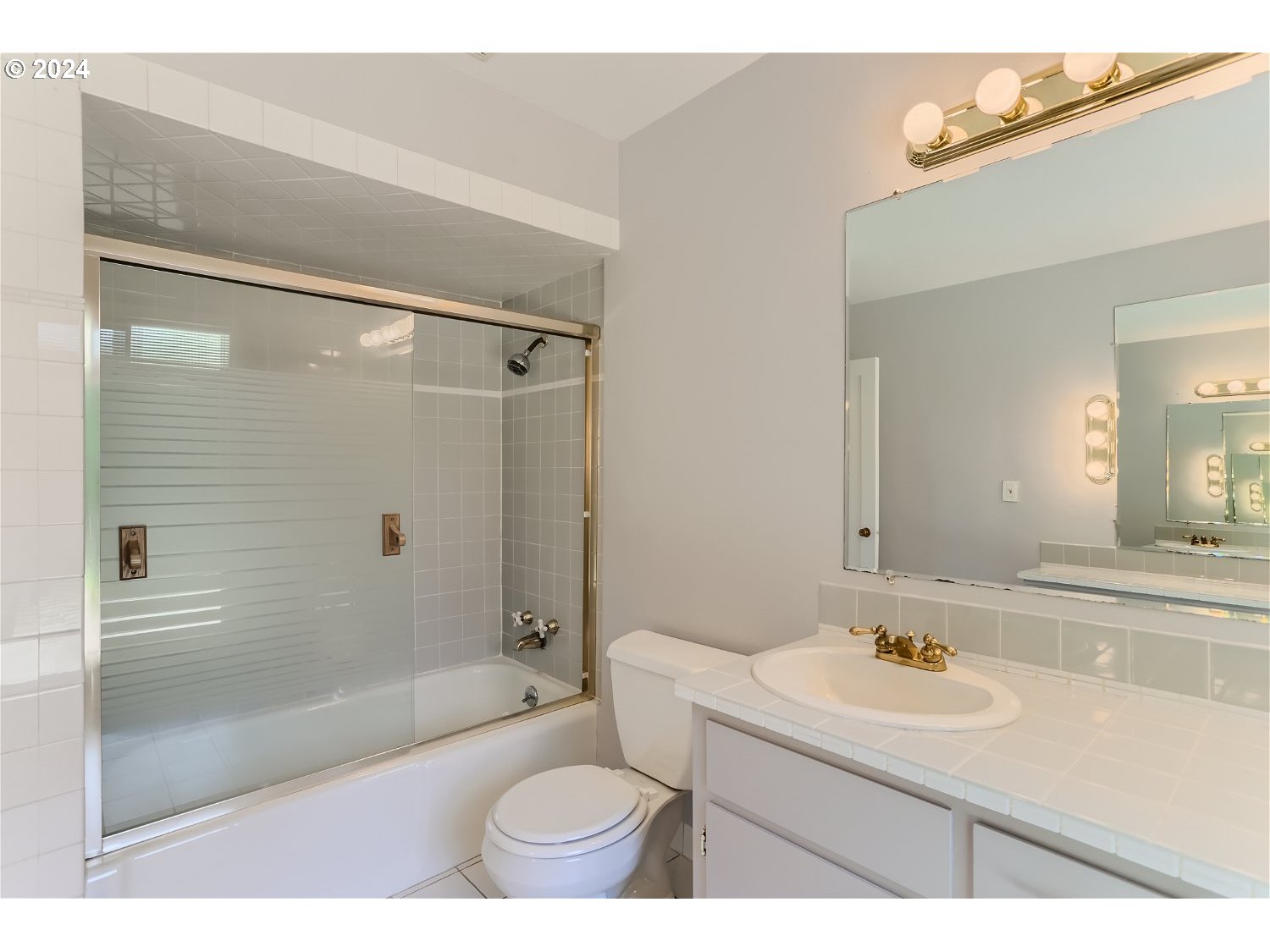 9386 Southwest 35th Avenue Portland, OR 97219 - Photo 23 of 29 a bathroom with a sink toilet double vanity and bathtub