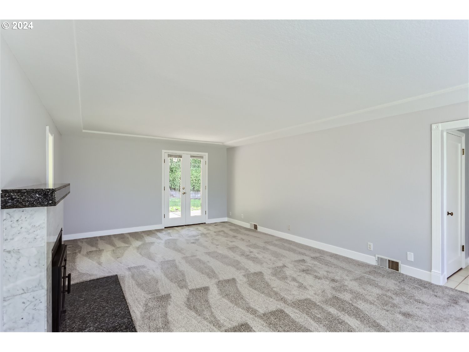 9386 Southwest 35th Avenue Portland, OR 97219 - Photo 8 of 29 a view of an empty room with a window