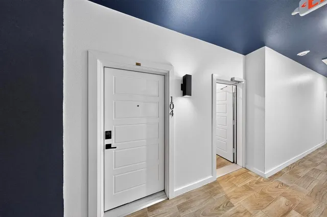 a view of a refrigerator in kitchen and entryway
