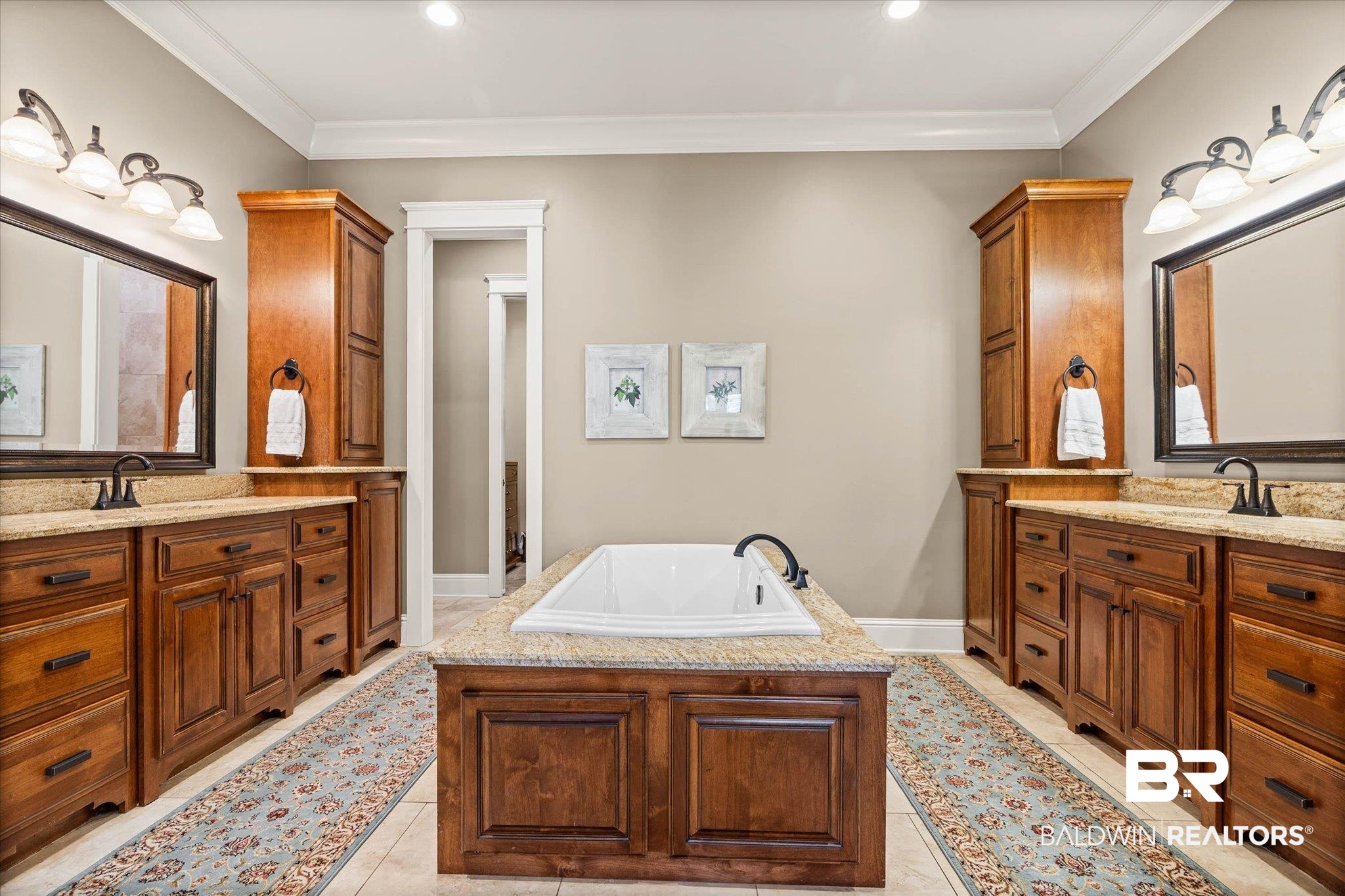 7676 Rockstone Lane Mobile, AL 36695 - Photo 18 of 47 Bathroom featuring ornamental molding, two vanities, and a garden tub