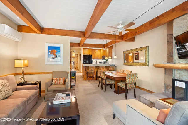 a dining room with furniture and window