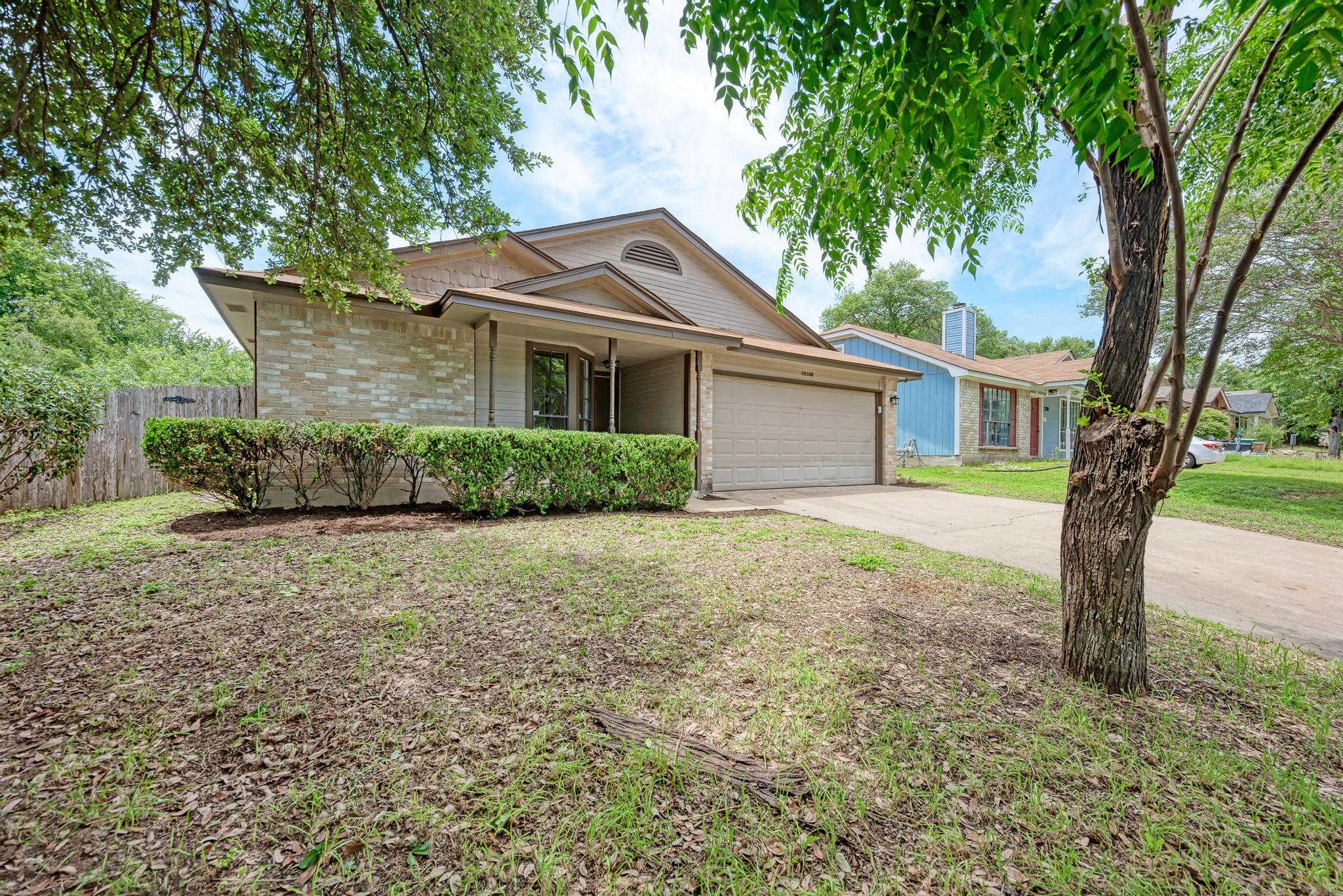 12108 Carnforth Drive Austin, TX 78753 - Photo 3 of 33 a house with a tree in front of it