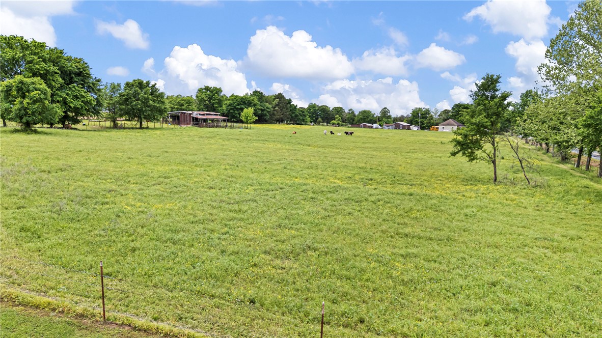0 Wire Road Mulberry, AR 72947 - Photo 28 of 31 Expansive green pastures featuring scattered trees and a distant barn structure