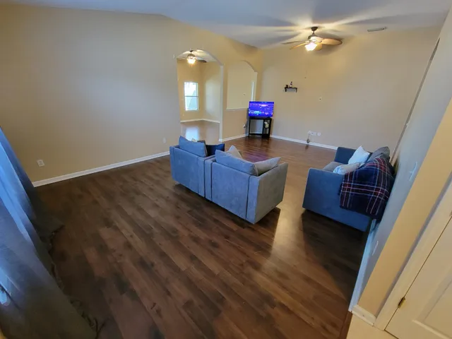 a living room with furniture and a window