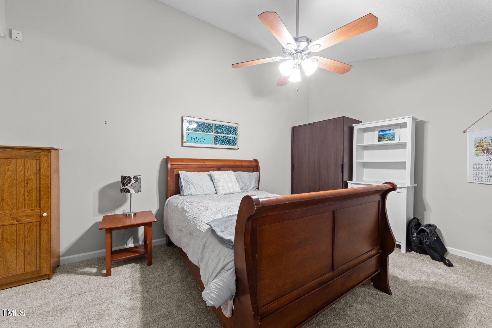 11901 North North Exeter Way Way Raleigh, NC 27613 - Photo 14 of 39 a bedroom with bed and window