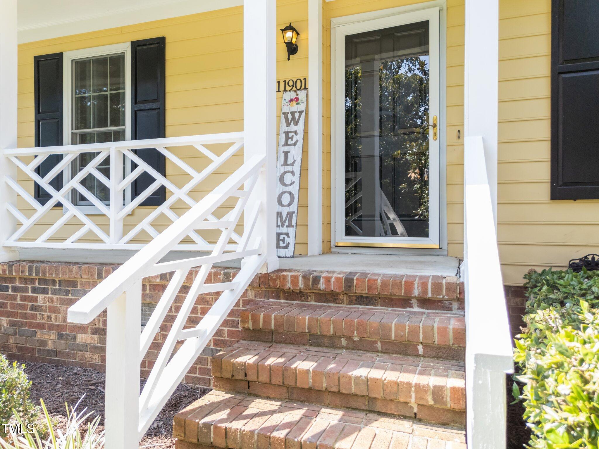 11901 North North Exeter Way Way Raleigh, NC 27613 - Photo 3 of 39 a view of front door of house with a outdoor space