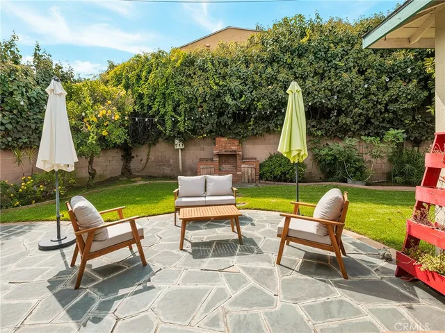 a view of a two chairs in a patio