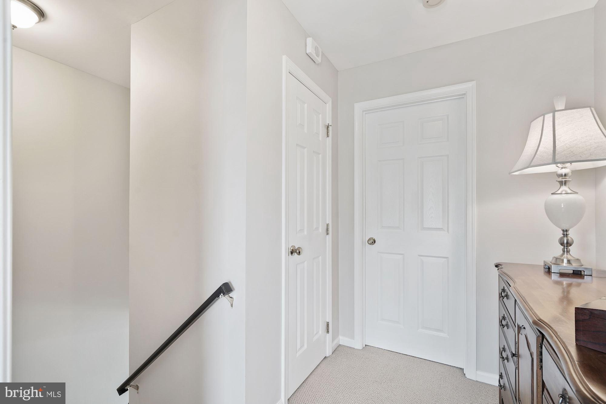 11478 Heritage Commons Way Reston, VA 20194 - Photo 22 of 43 A hallway connecting the bedrooms