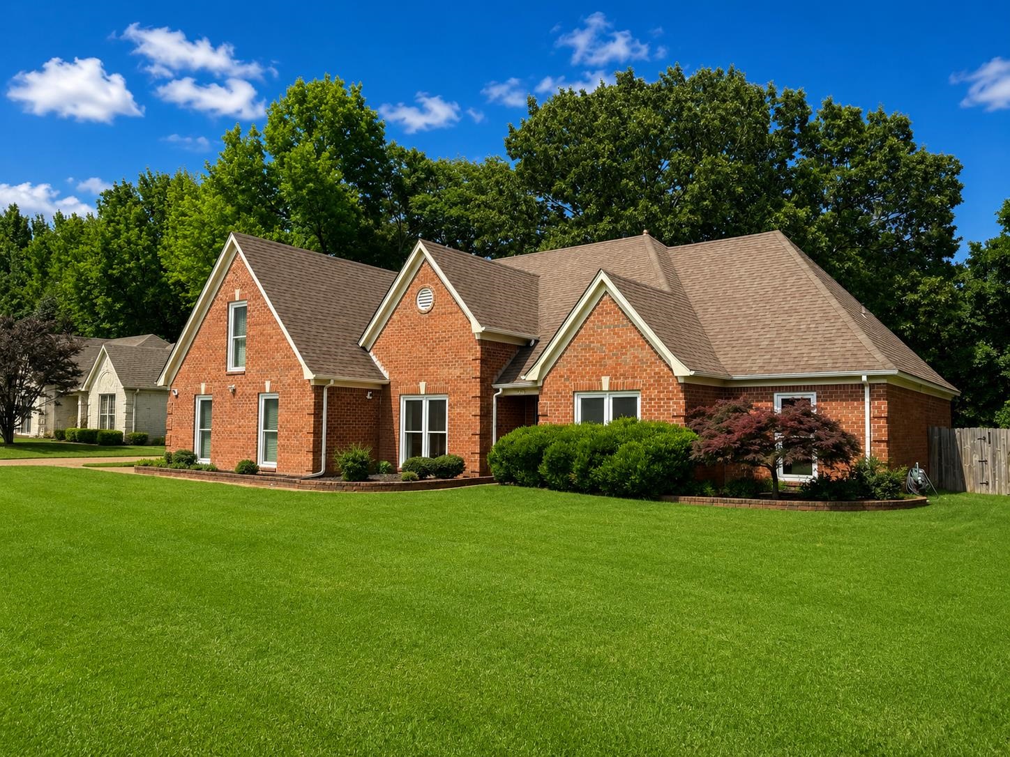 326 South Sanga Road Cordova, TN 38018 - Photo 3 of 32 Traditional brick residence featuring a prominent gabled roofline and white-trimmed windows