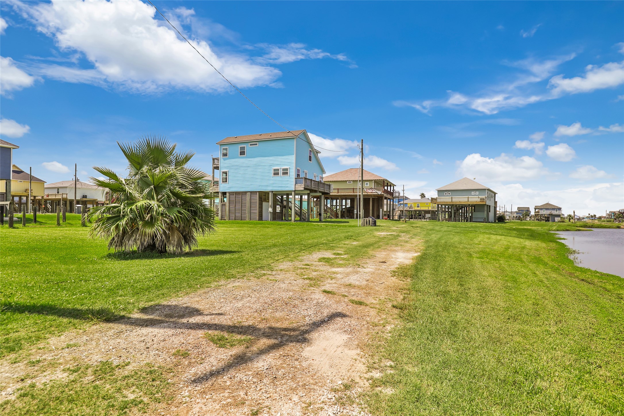 2116 Canal Crystal Beach, TX 77650 - Photo 2 of 45 a view of a house with a yard