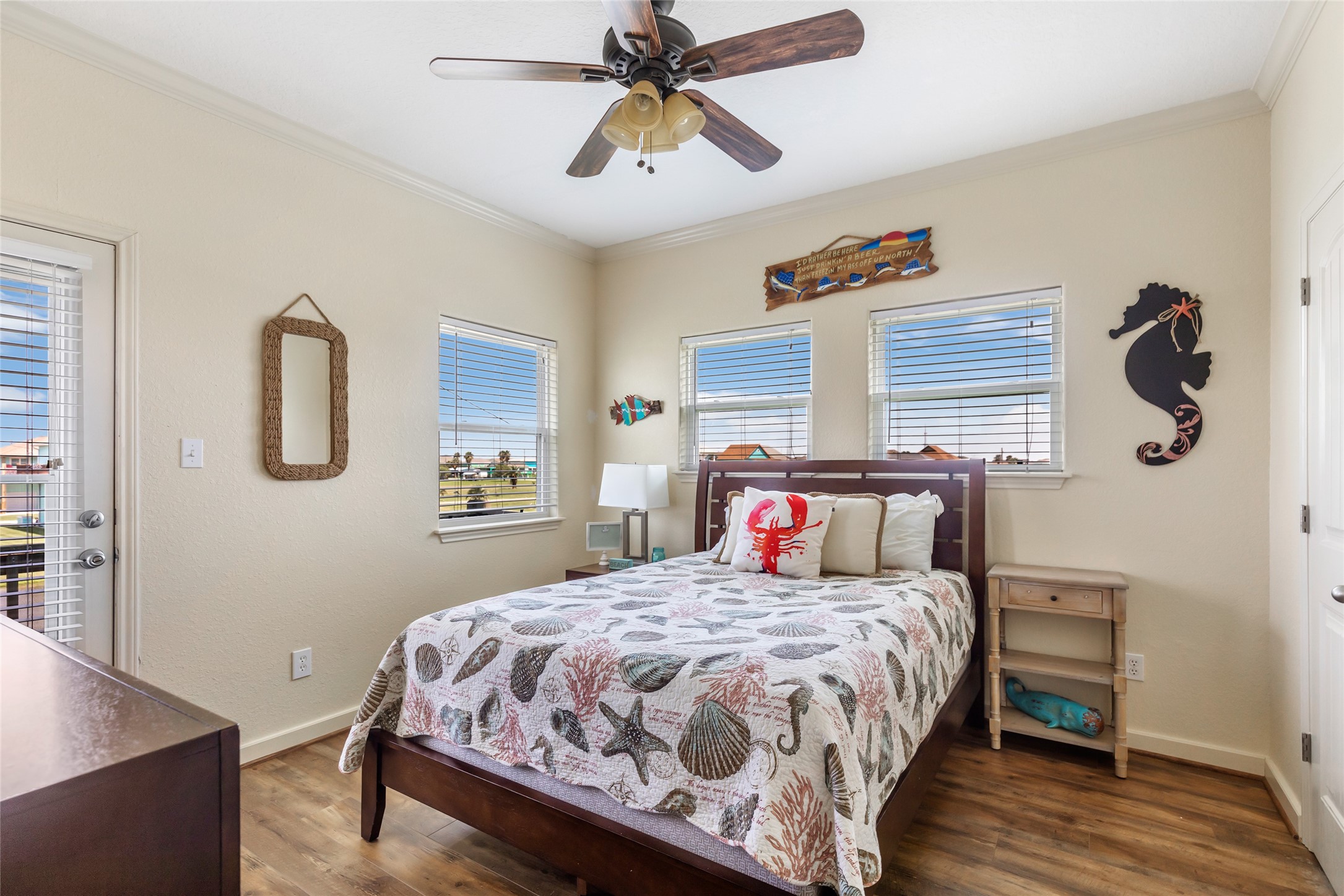 2116 Canal Crystal Beach, TX 77650 - Photo 31 of 45 a bedroom with a bed and wooden floor