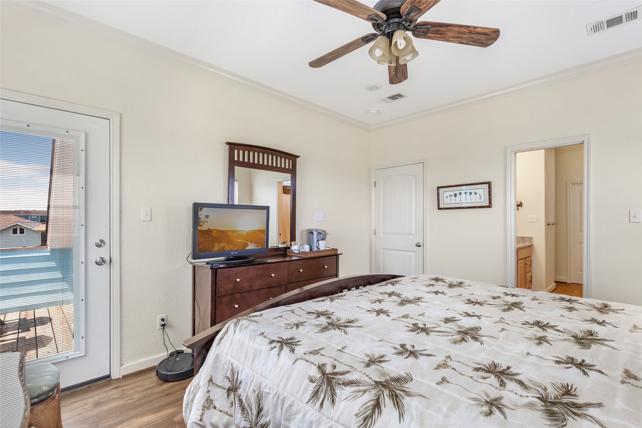 2116 Canal Crystal Beach, TX 77650 - Photo 34 of 45 a bedroom with a bed and wooden floor