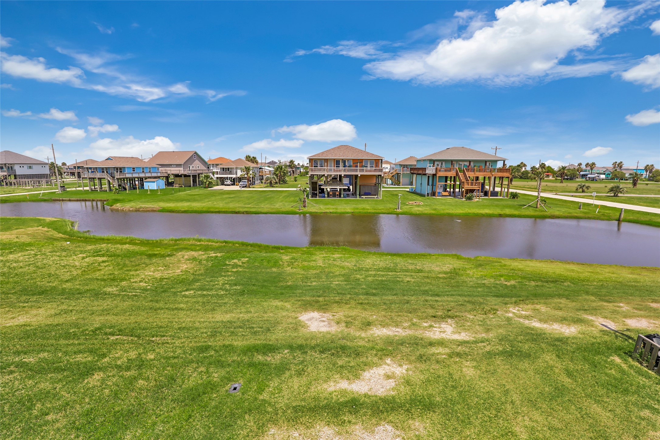 2116 Canal Crystal Beach, TX 77650 - Photo 4 of 45 a view of building with lake and houses in the background