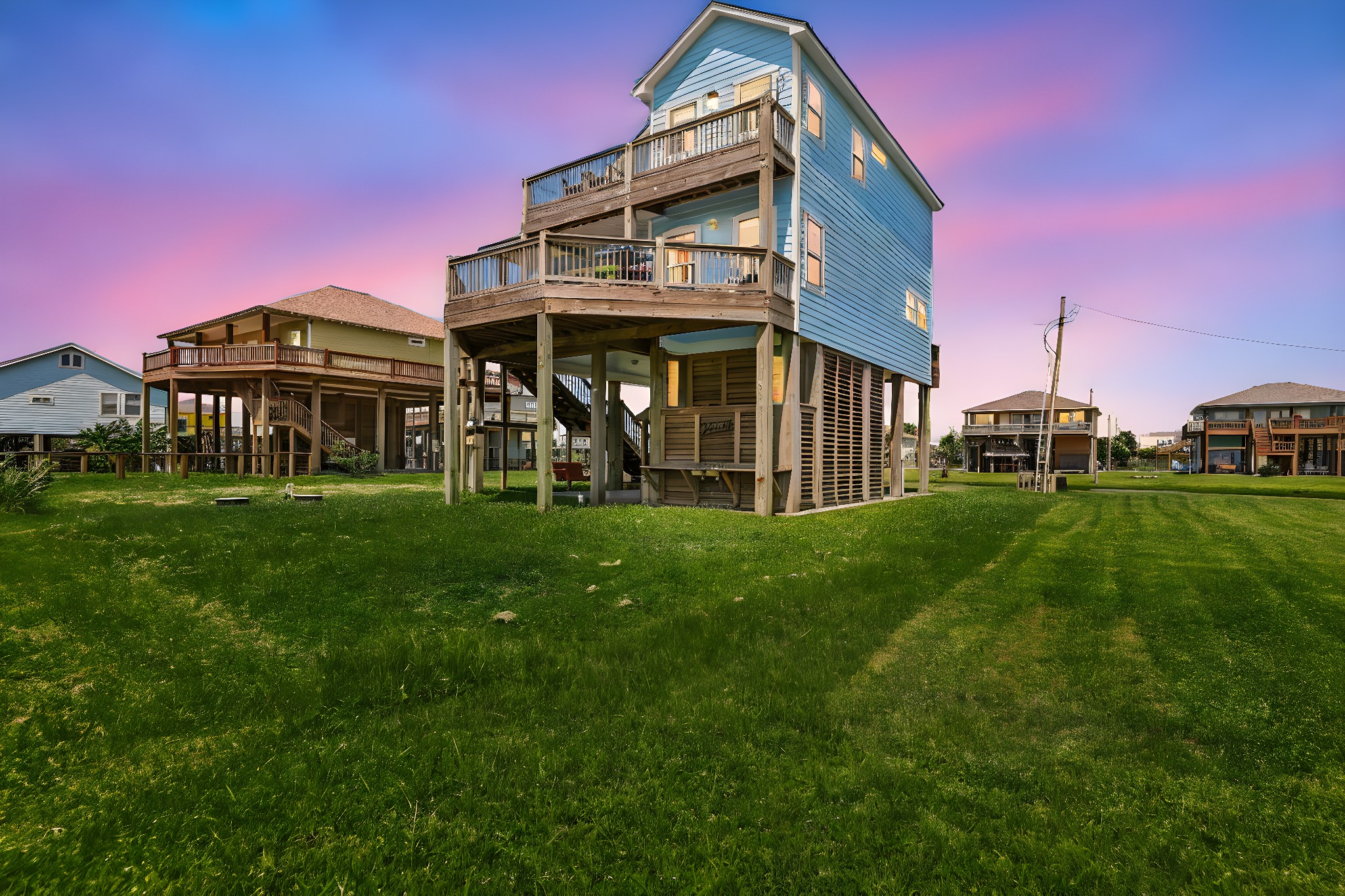 2116 Canal Crystal Beach, TX 77650 - Photo 42 of 45 a front view of a house with a garden