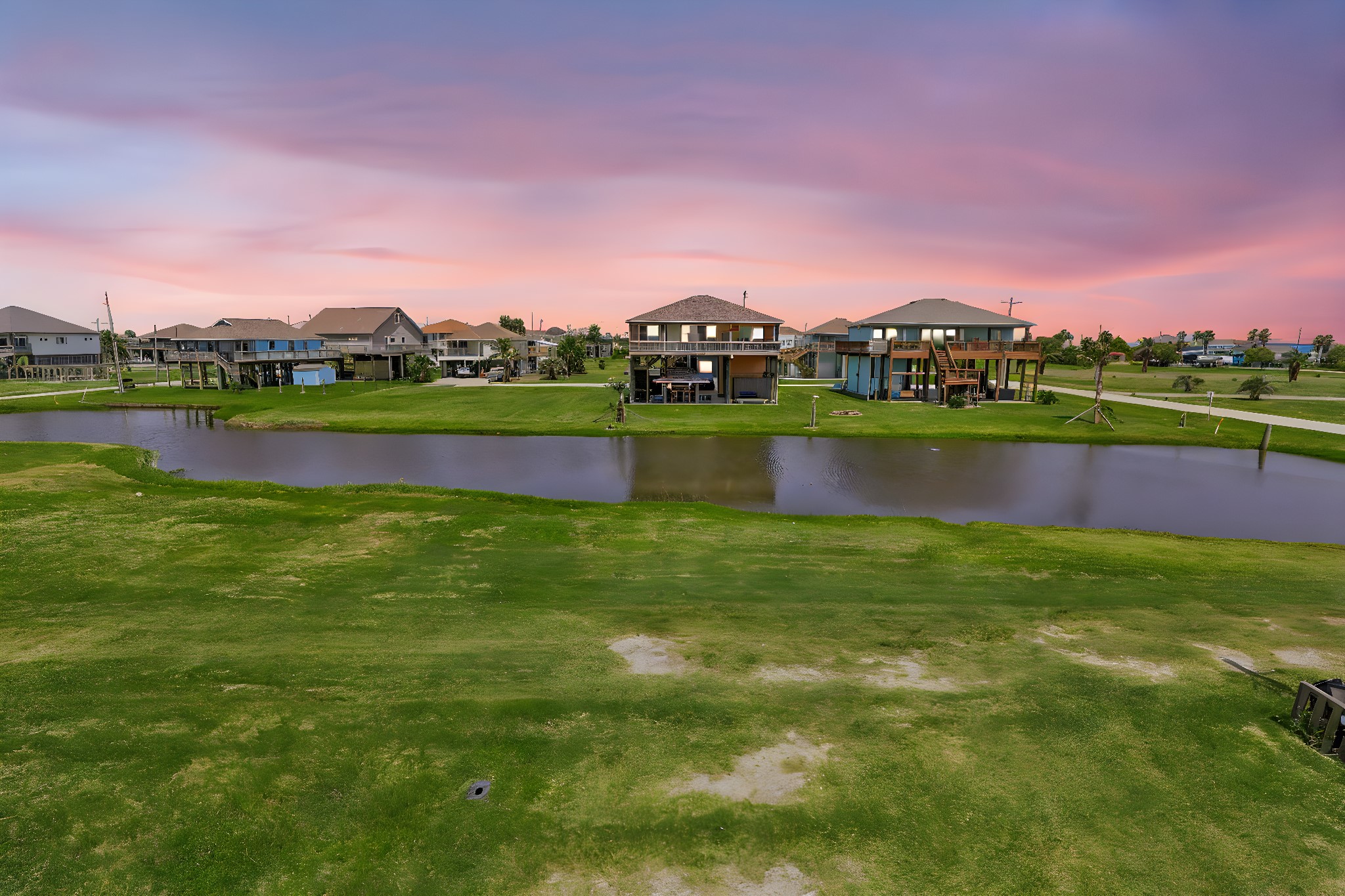 2116 Canal Crystal Beach, TX 77650 - Photo 44 of 45 a view of a lake with houses in the background
