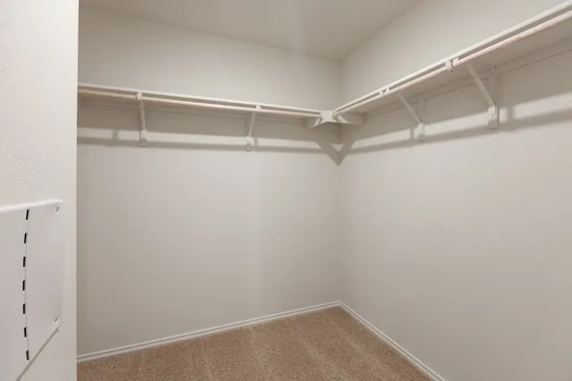 a view of an empty walk in closet