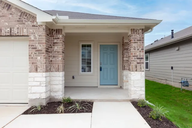 a view of house with backyard