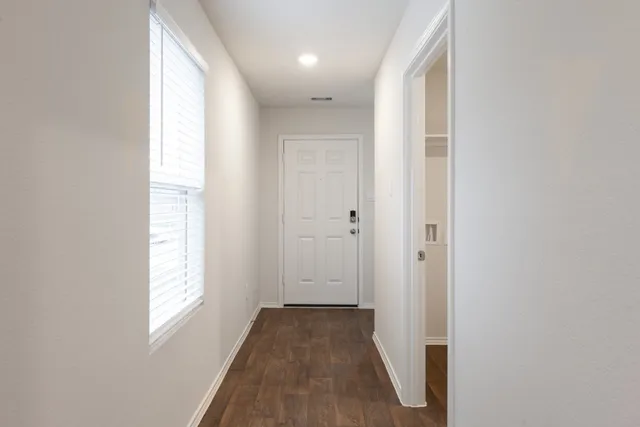a view of hallway with windows