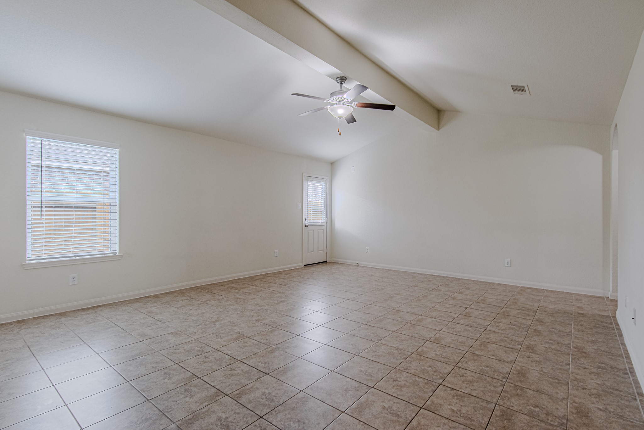 9522 Olive Stone Drive Rosharon, TX 77583 - Photo 7 of 29 an empty room with windows and fan