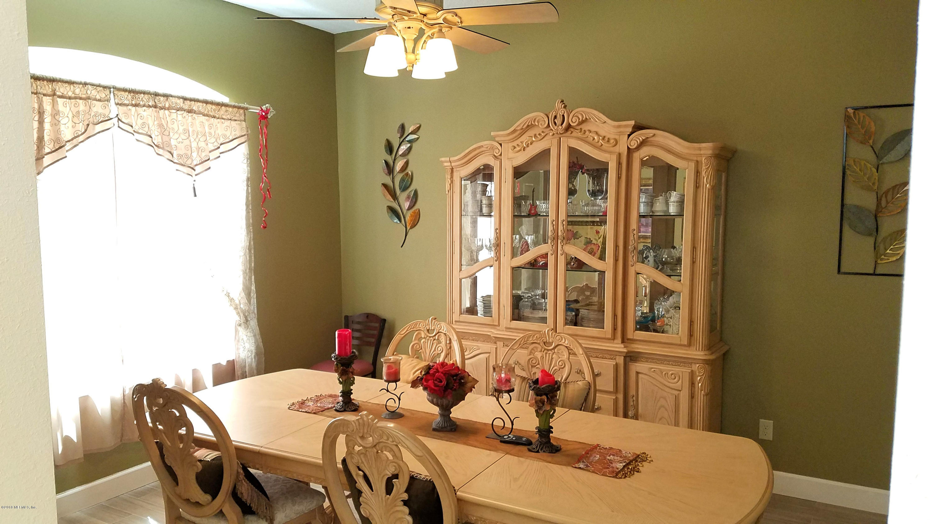 1205 Marlee Road St. Johns, FL 32259 - Photo 13 of 36 a view of a dining room with furniture and chandelier