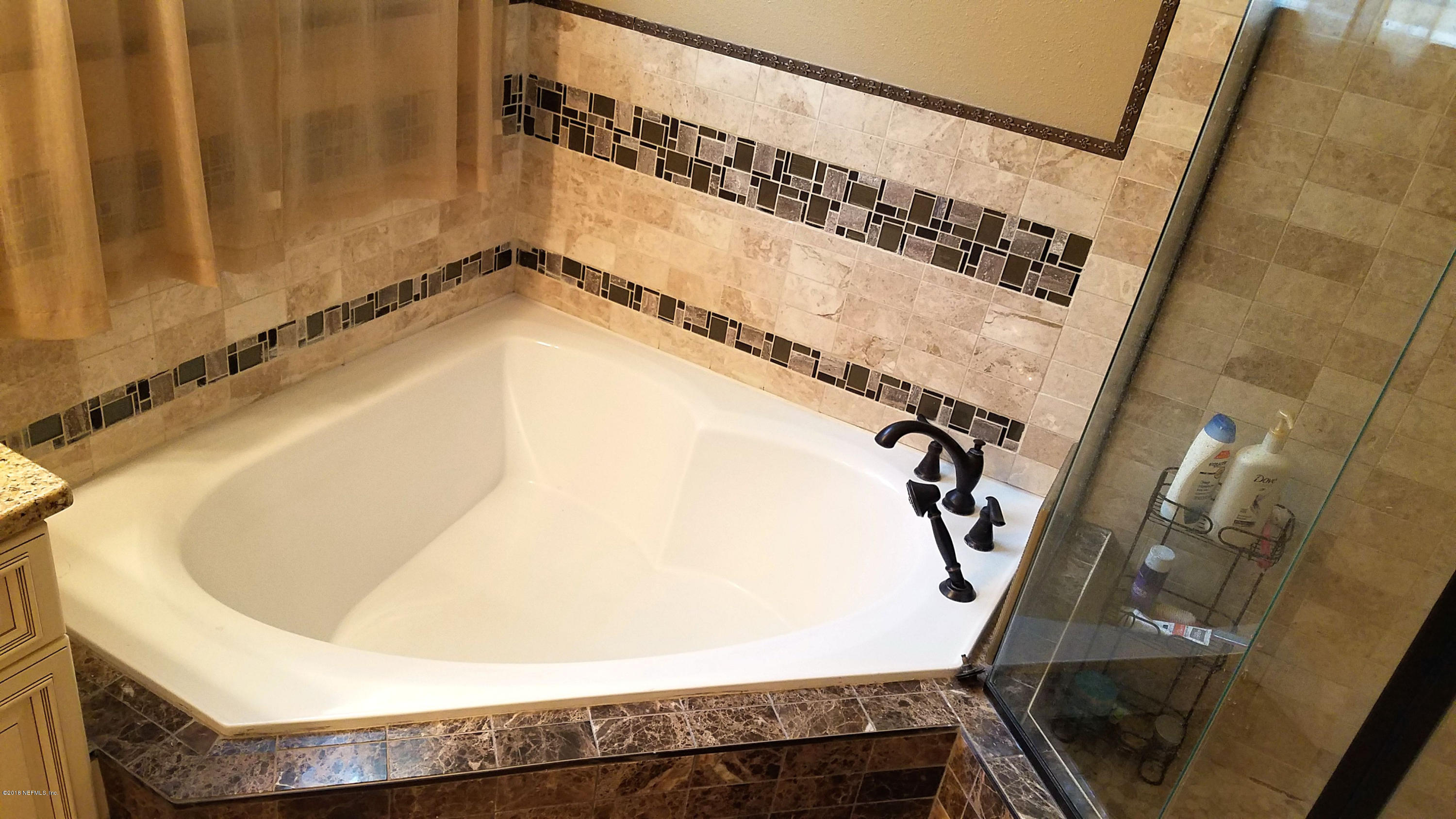 1205 Marlee Road St. Johns, FL 32259 - Photo 17 of 36 a bathroom with a bathtub