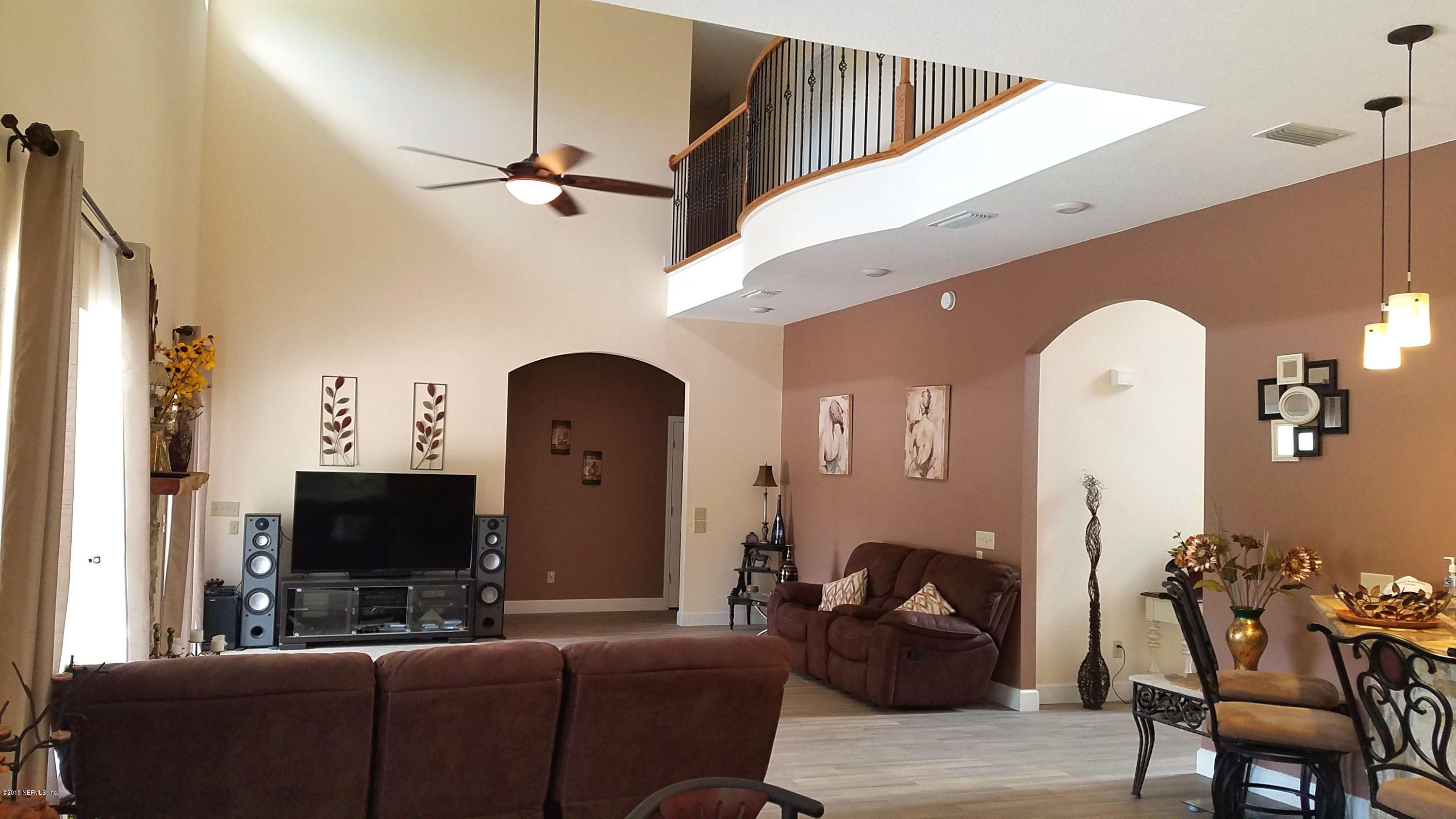 1205 Marlee Road St. Johns, FL 32259 - Photo 8 of 36 a living room with furniture and a flat screen tv