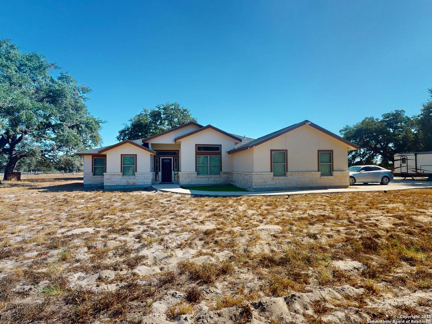 3992 Fm 1784 Pleasanton, TX 78064 - Photo 2 of 38 a house view with a backyard space