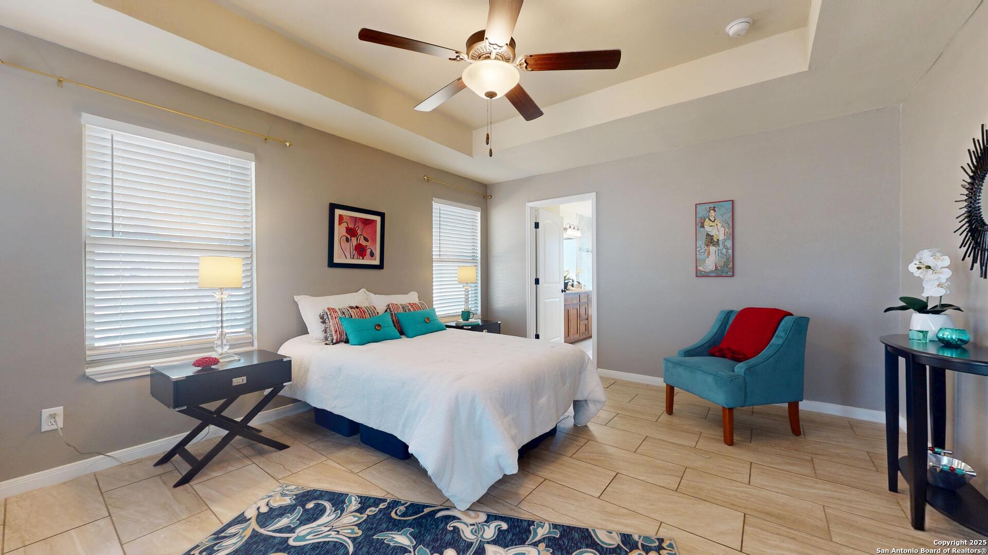 3992 Fm 1784 Pleasanton, TX 78064 - Photo 21 of 38 a bedroom with a bed and a chandelier