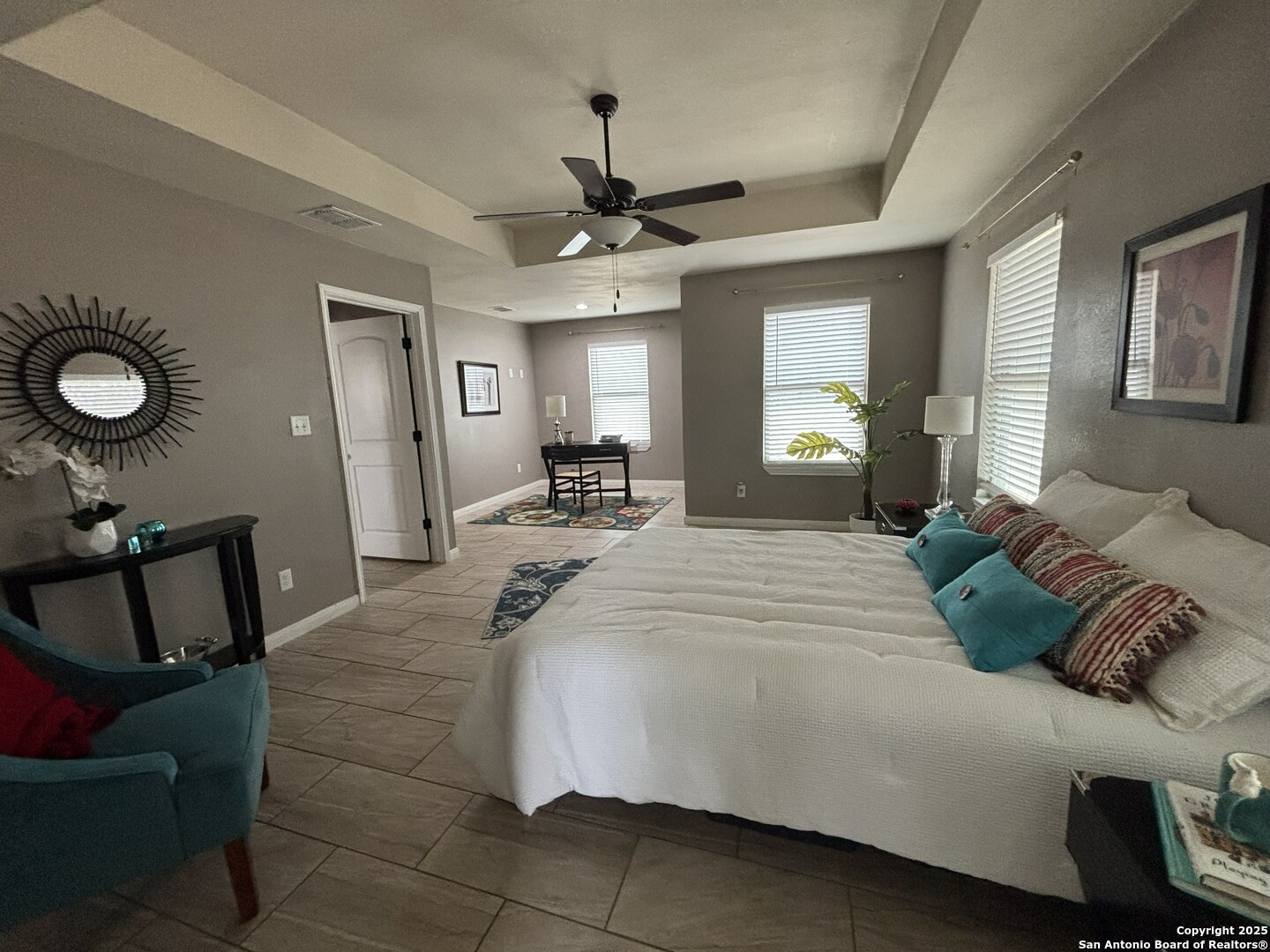 3992 Fm 1784 Pleasanton, TX 78064 - Photo 24 of 38 a bedroom with a bed a mirror and a window