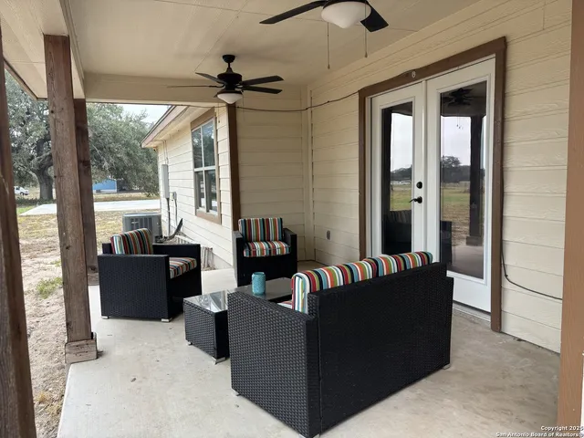 a backyard of a house with large trees and outdoor space