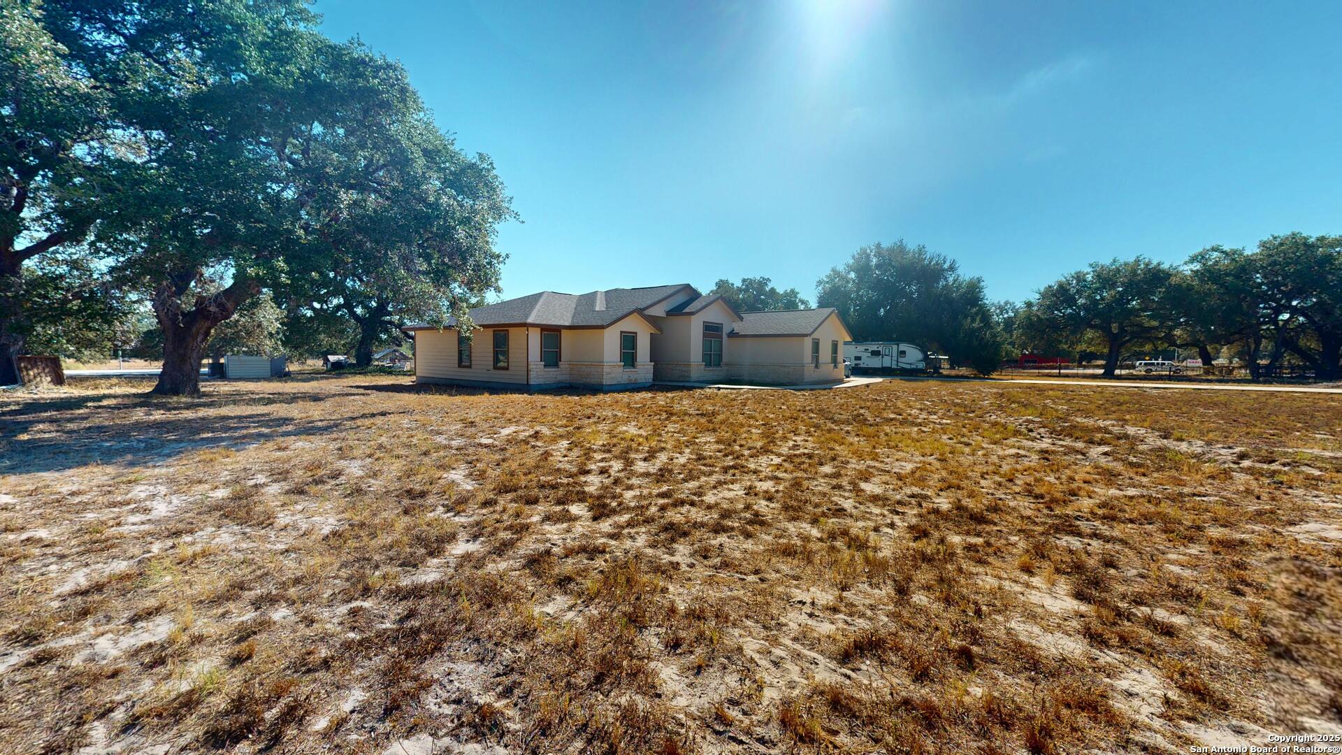 3992 Fm 1784 Pleasanton, TX 78064 - Photo 31 of 38 a view of a large yard with large trees