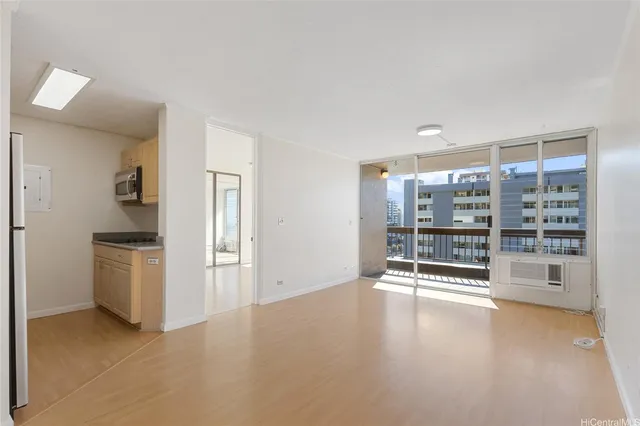 wooden floor in an empty room with a fireplace