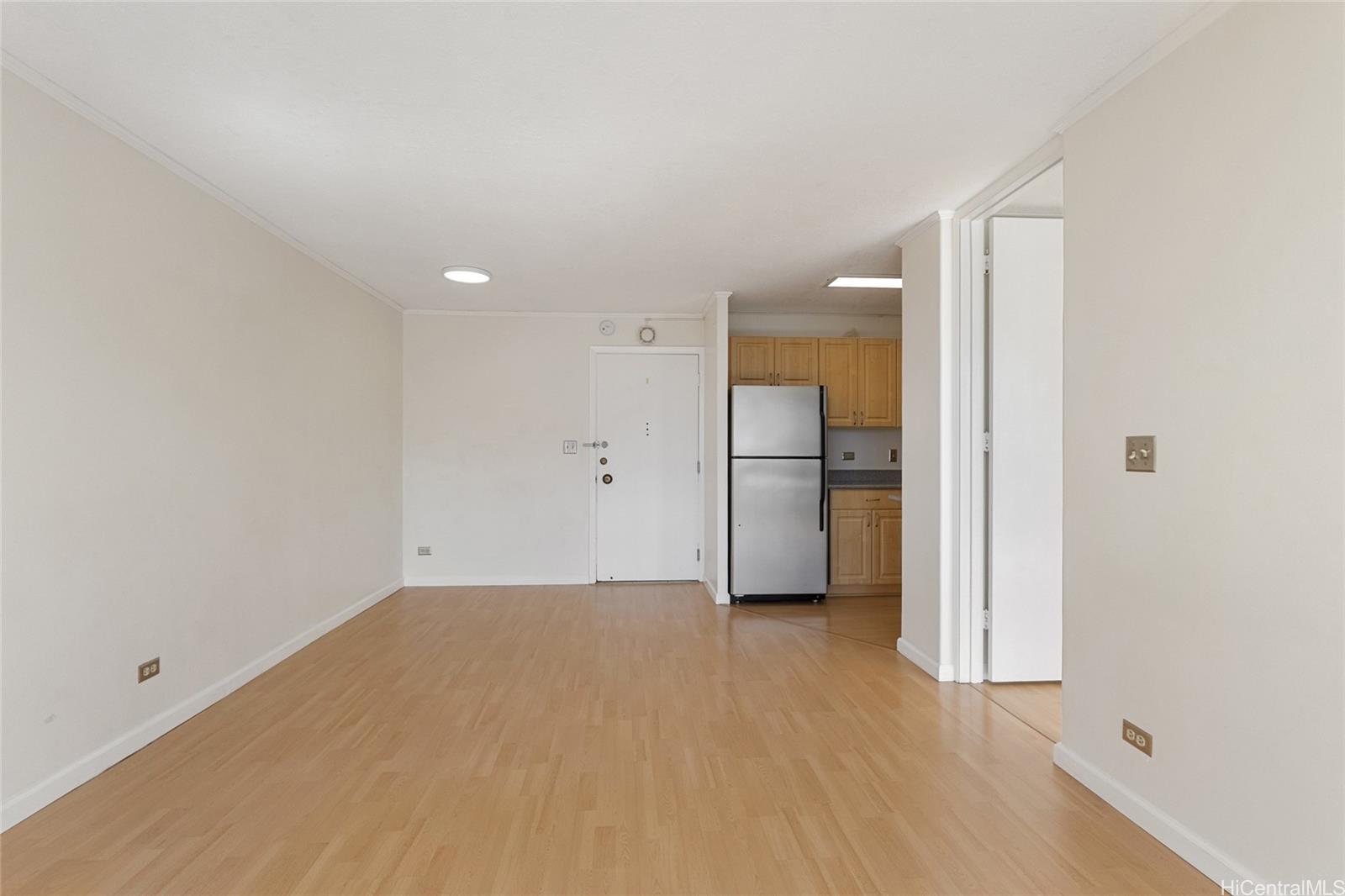 775 Kinalau Place, Unit 1003 Honolulu, HI 96813 - Photo 3 of 25 a view of empty room with a kitchen
