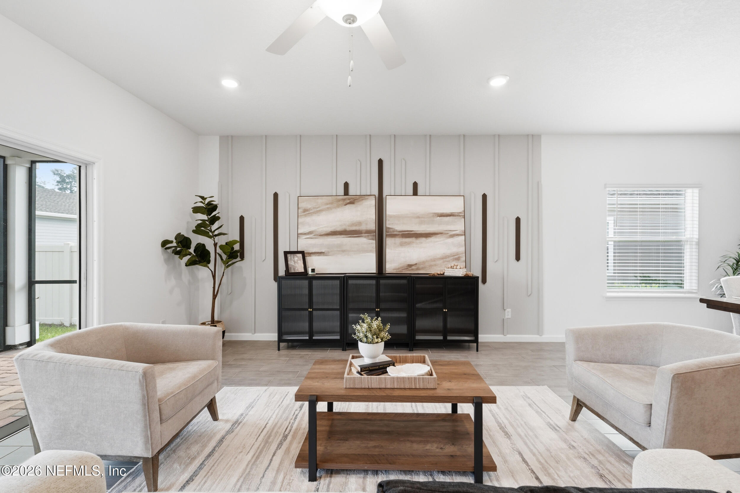 32 Ren Way St. Johns, FL 32259 - Photo 11 of 57 a living room with fireplace furniture and a large window