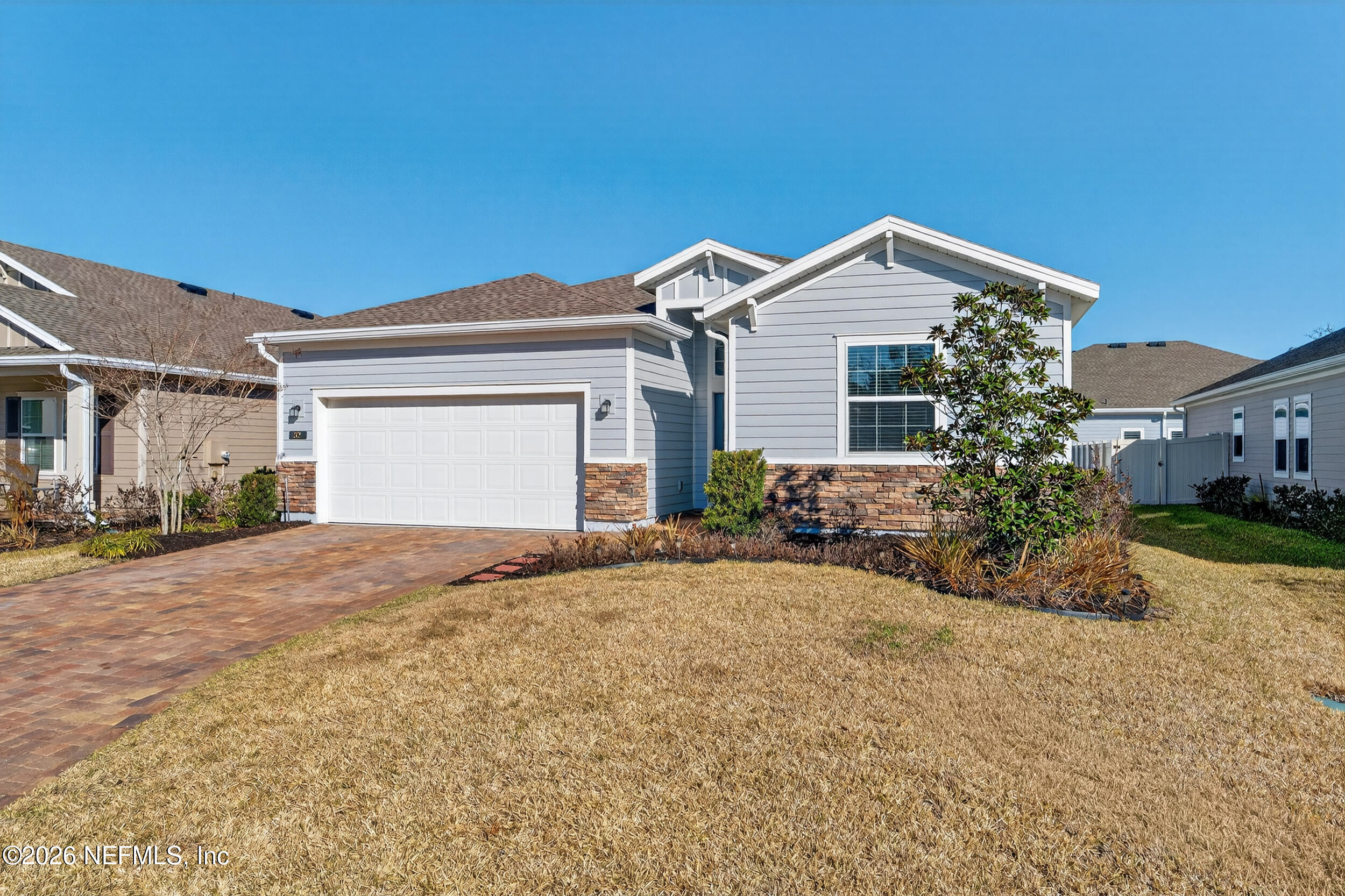32 Ren Way St. Johns, FL 32259 - Photo 43 of 57 a front view of a house with a yard and garage