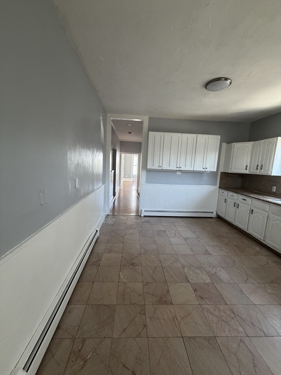 40 Rogers Avenue, Unit 2 Lynn, MA 01902 - Photo 5 of 15 a view of an empty room and window