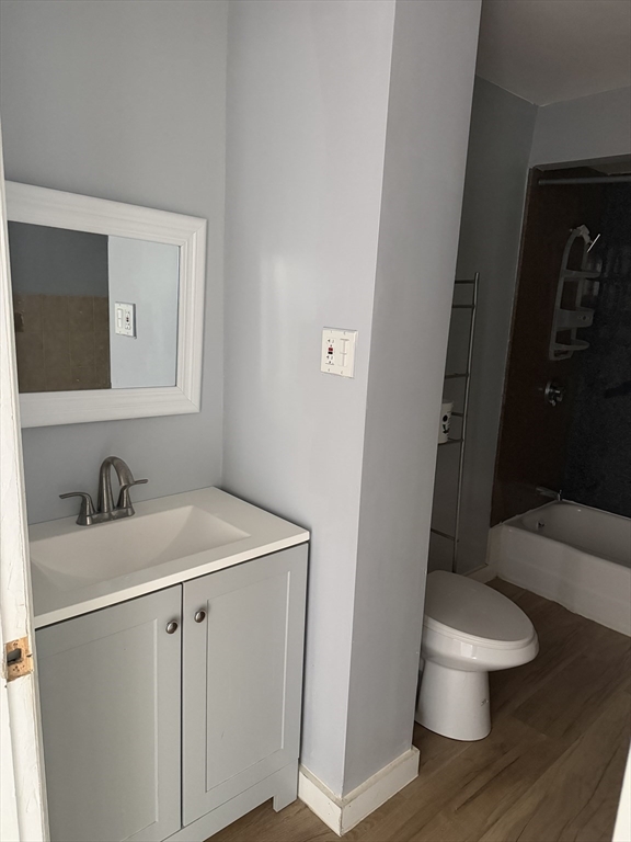 40 Rogers Avenue, Unit 2 Lynn, MA 01902 - Photo 9 of 15 a bathroom with a sink and a toilet