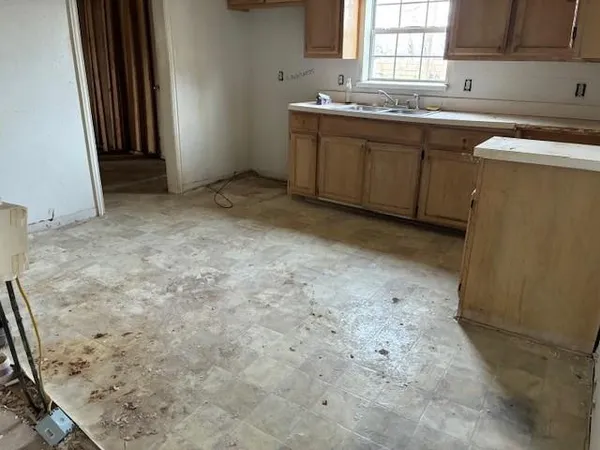 a view of livingroom with an empty space and window