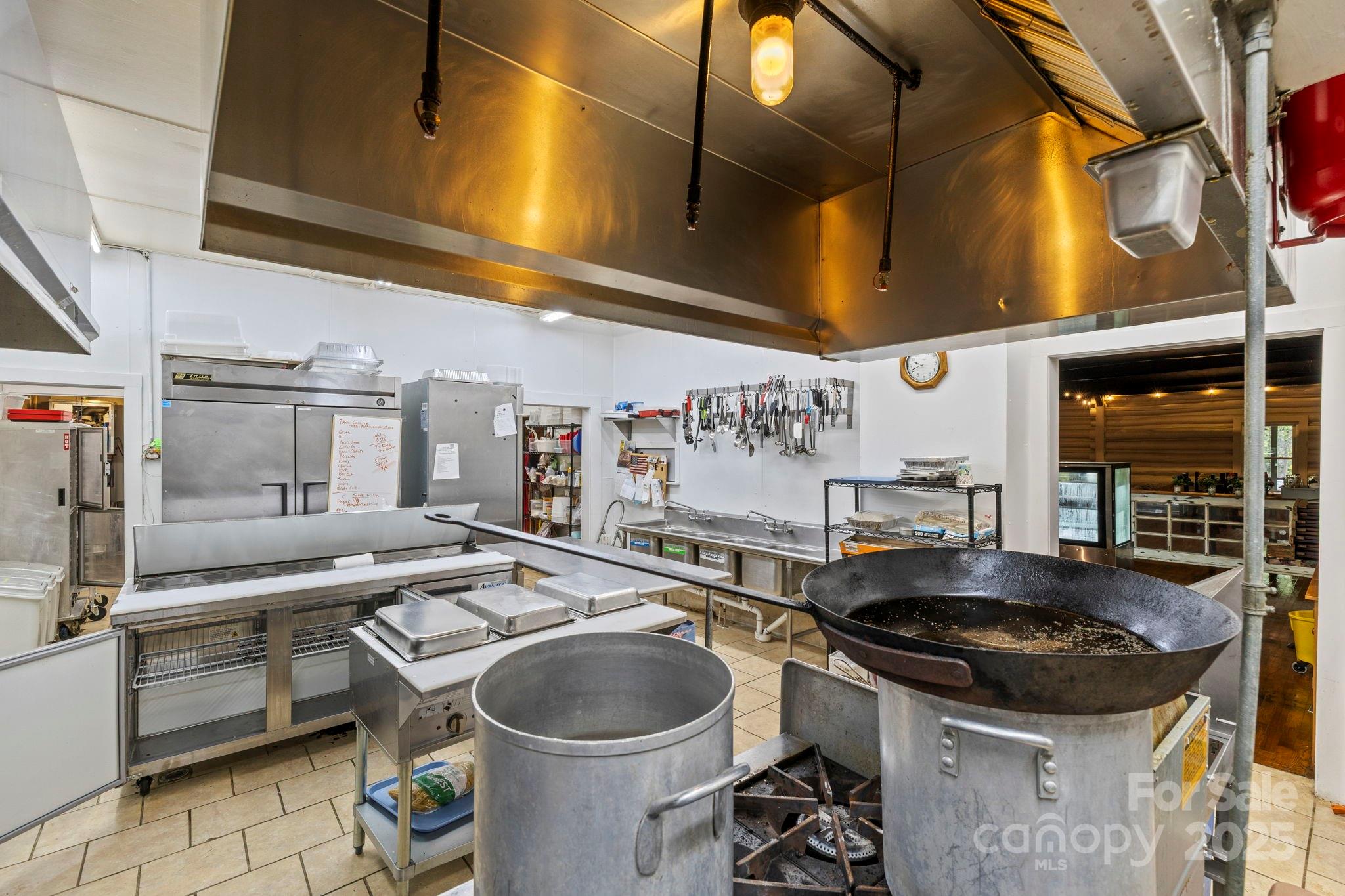 1196 North Country Club Road Brevard, NC 28712 - Photo 13 of 48 a kitchen with a sink a stove and cabinets