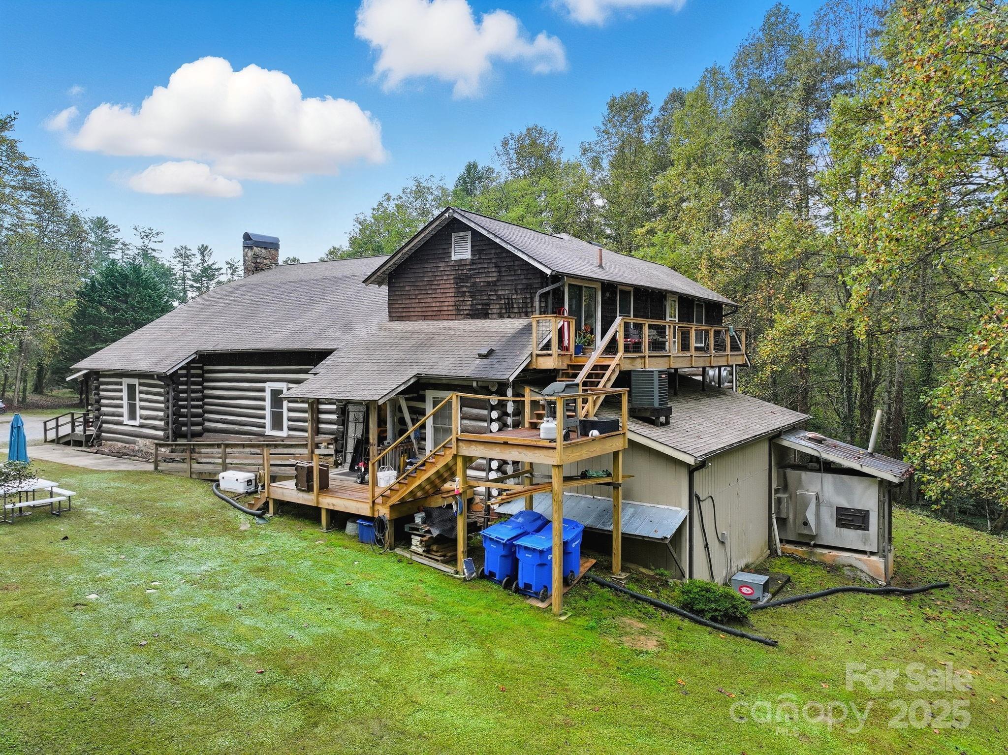 1196 North Country Club Road Brevard, NC 28712 - Photo 19 of 48 a aerial view of a house with swimming pool and sitting area