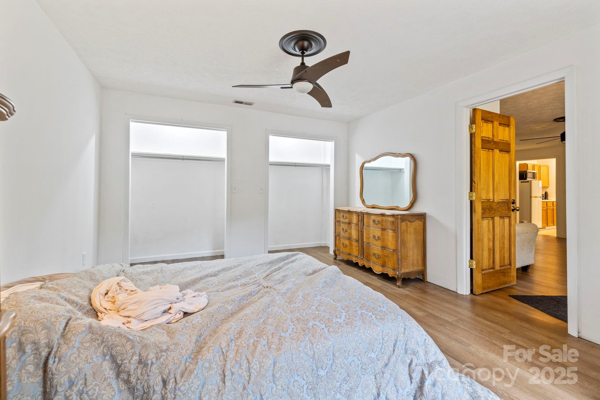 1196 North Country Club Road Brevard, NC 28712 - Photo 34 of 48 a bedroom with a bed and a mirror