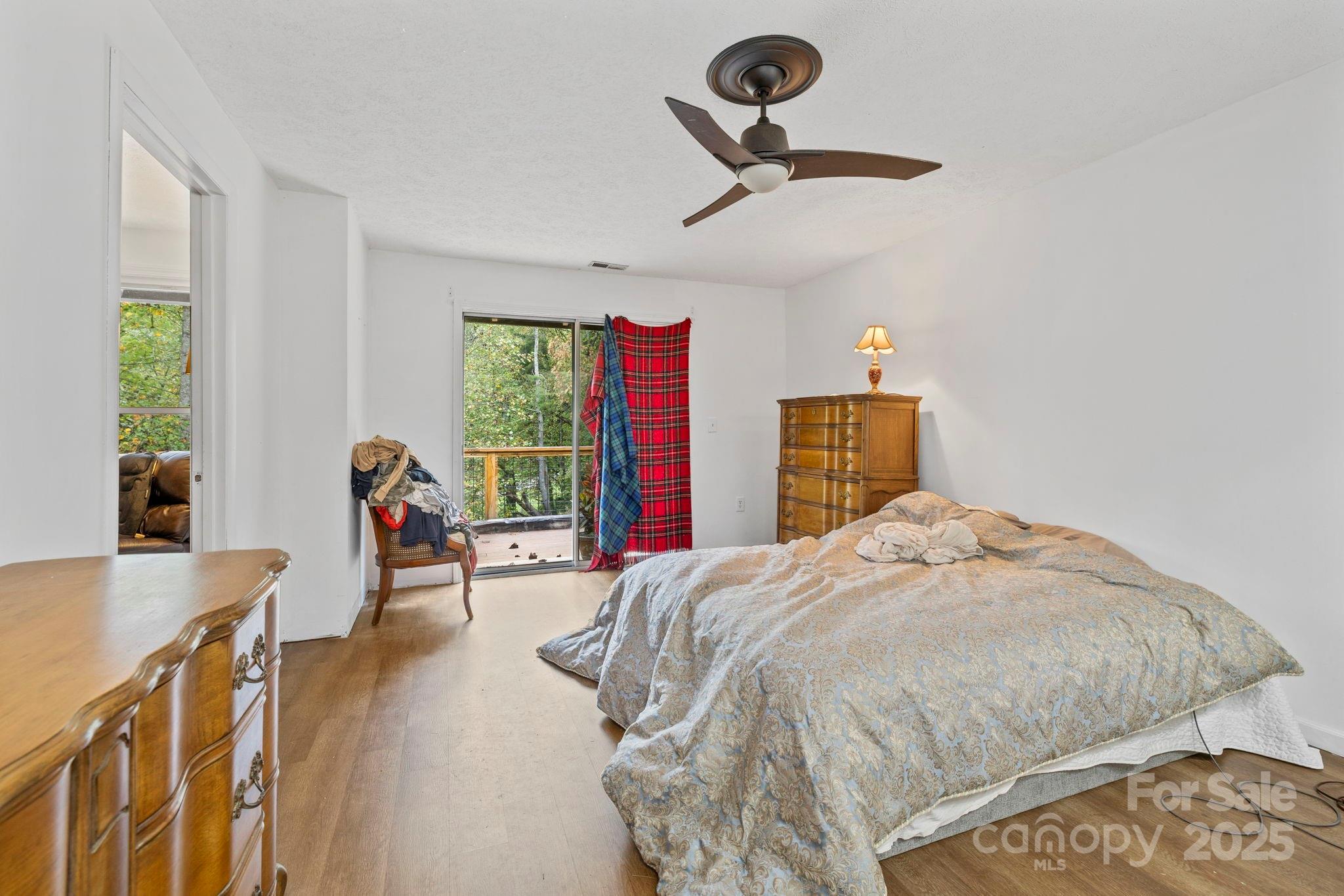 1196 North Country Club Road Brevard, NC 28712 - Photo 35 of 48 a bedroom with a bed and a dresser