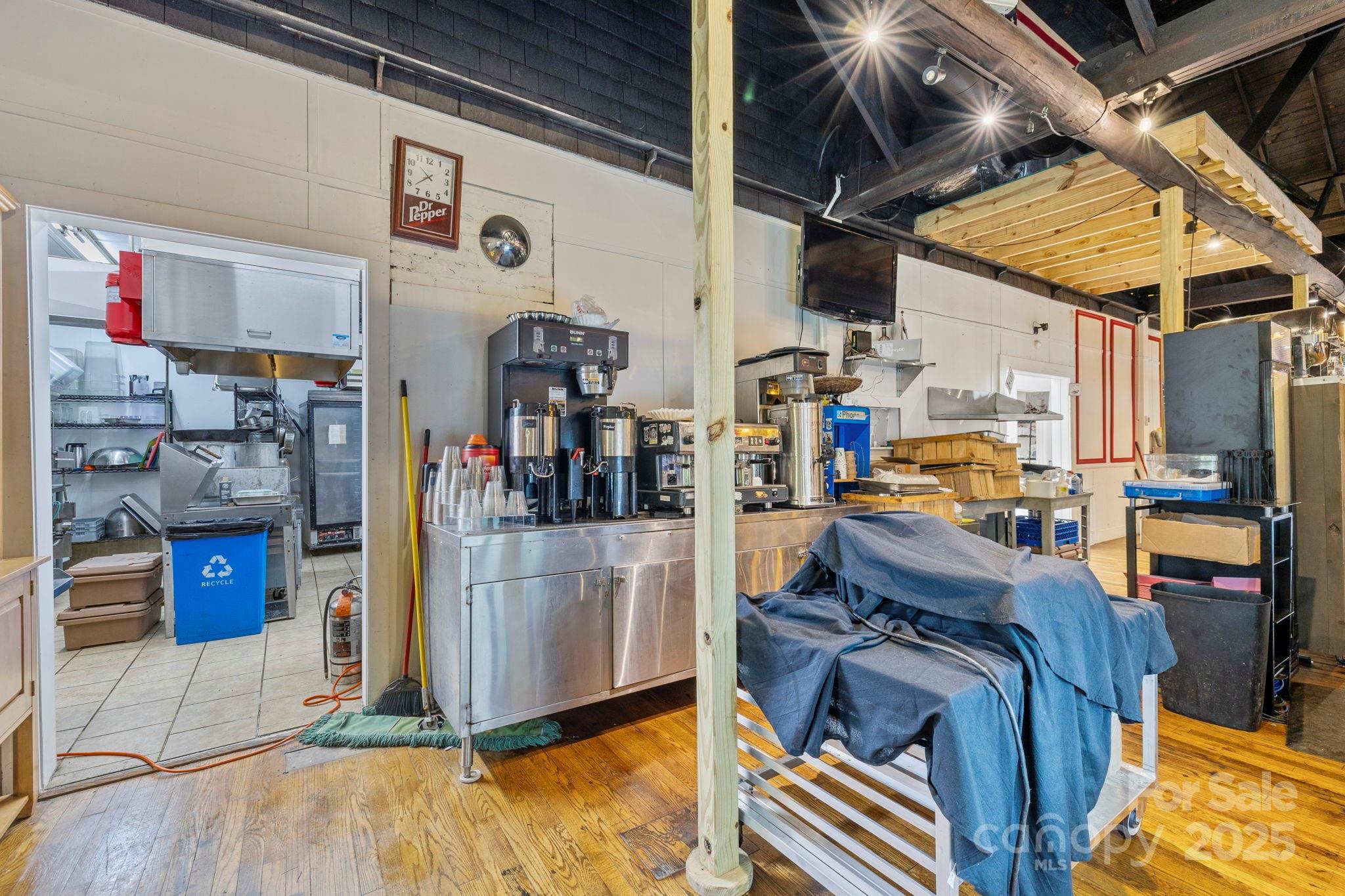 1196 North Country Club Road Brevard, NC 28712 - Photo 36 of 48 a view of a living room with a baby crib