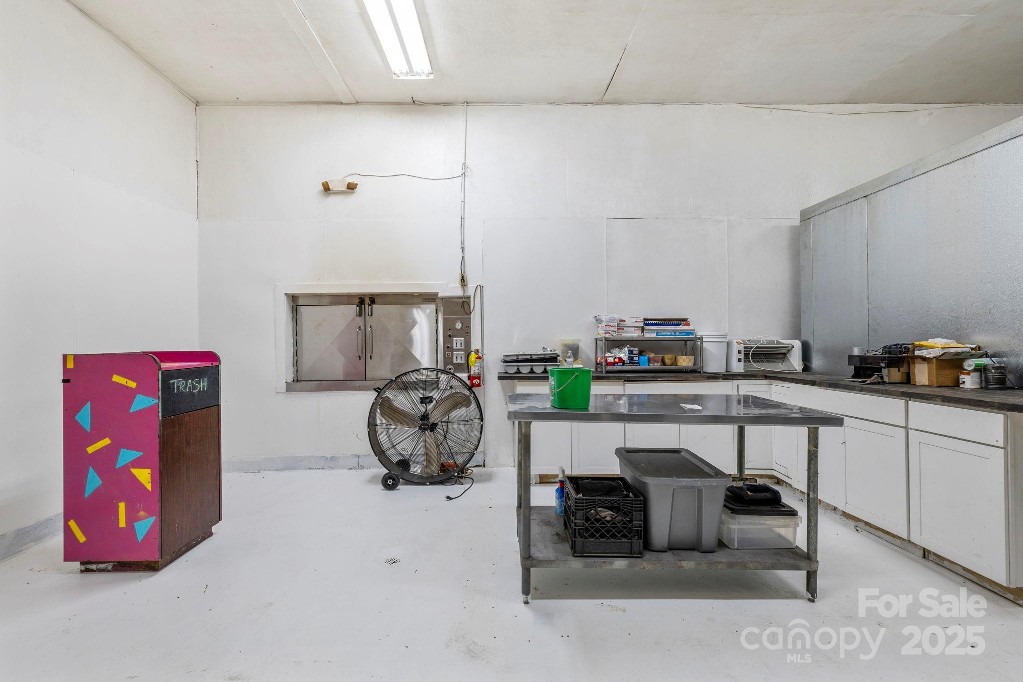 1196 North Country Club Road Brevard, NC 28712 - Photo 41 of 48 a living room with furniture a rug and white walls