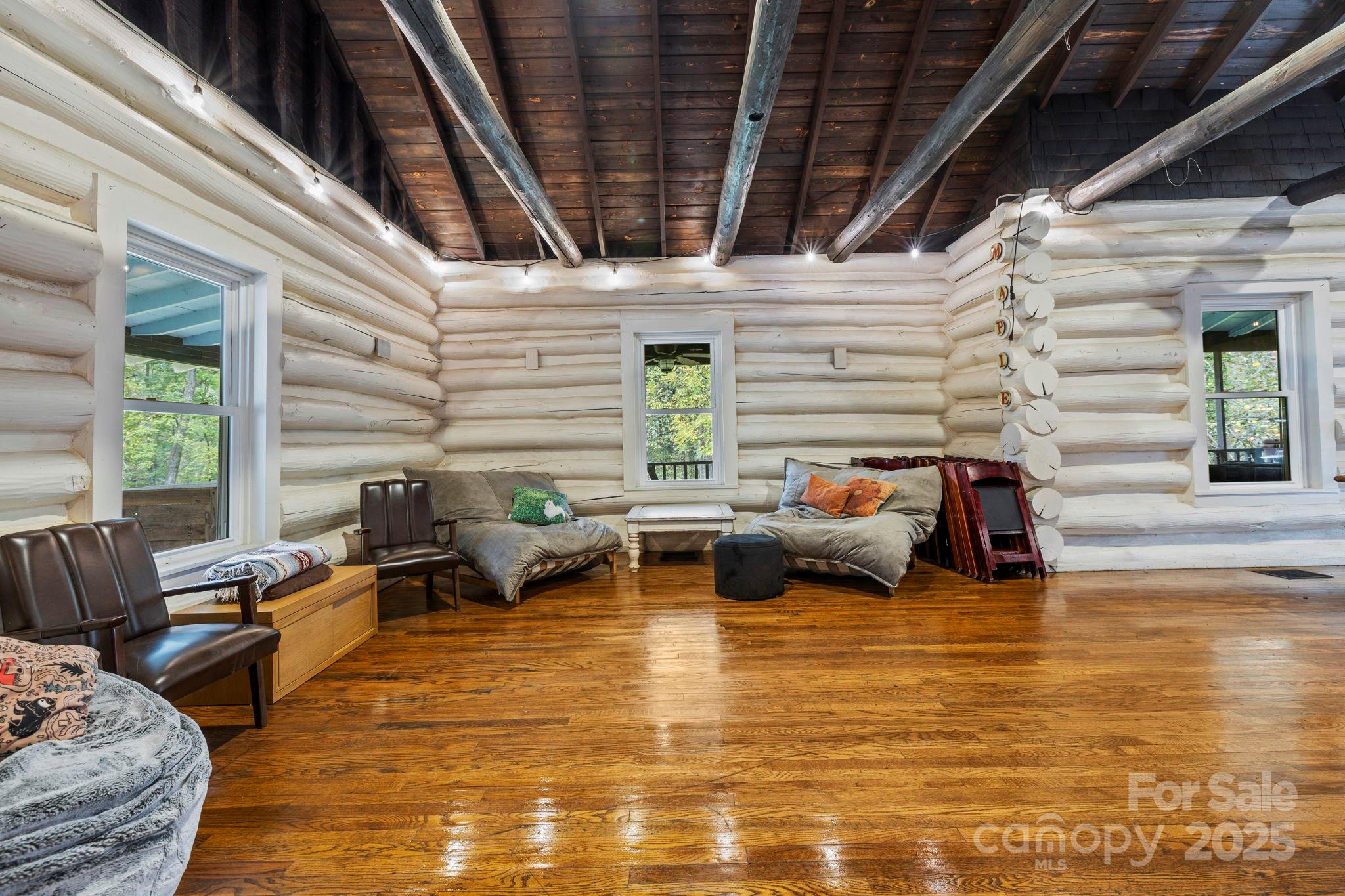 1196 North Country Club Road Brevard, NC 28712 - Photo 6 of 48 a living room with furniture and a large window