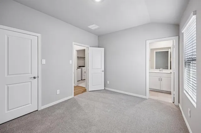 a view of an empty room and a room