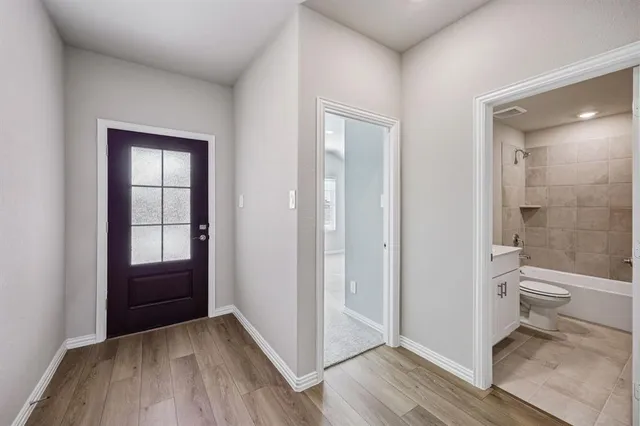 a view of a bathroom from a hallway