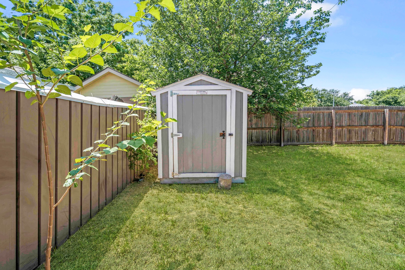 800 Smoke Signal Pass Pflugerville, TX 78660 - Photo 26 of 40 A well-maintained shed offers practical storage in this verdant backyard.