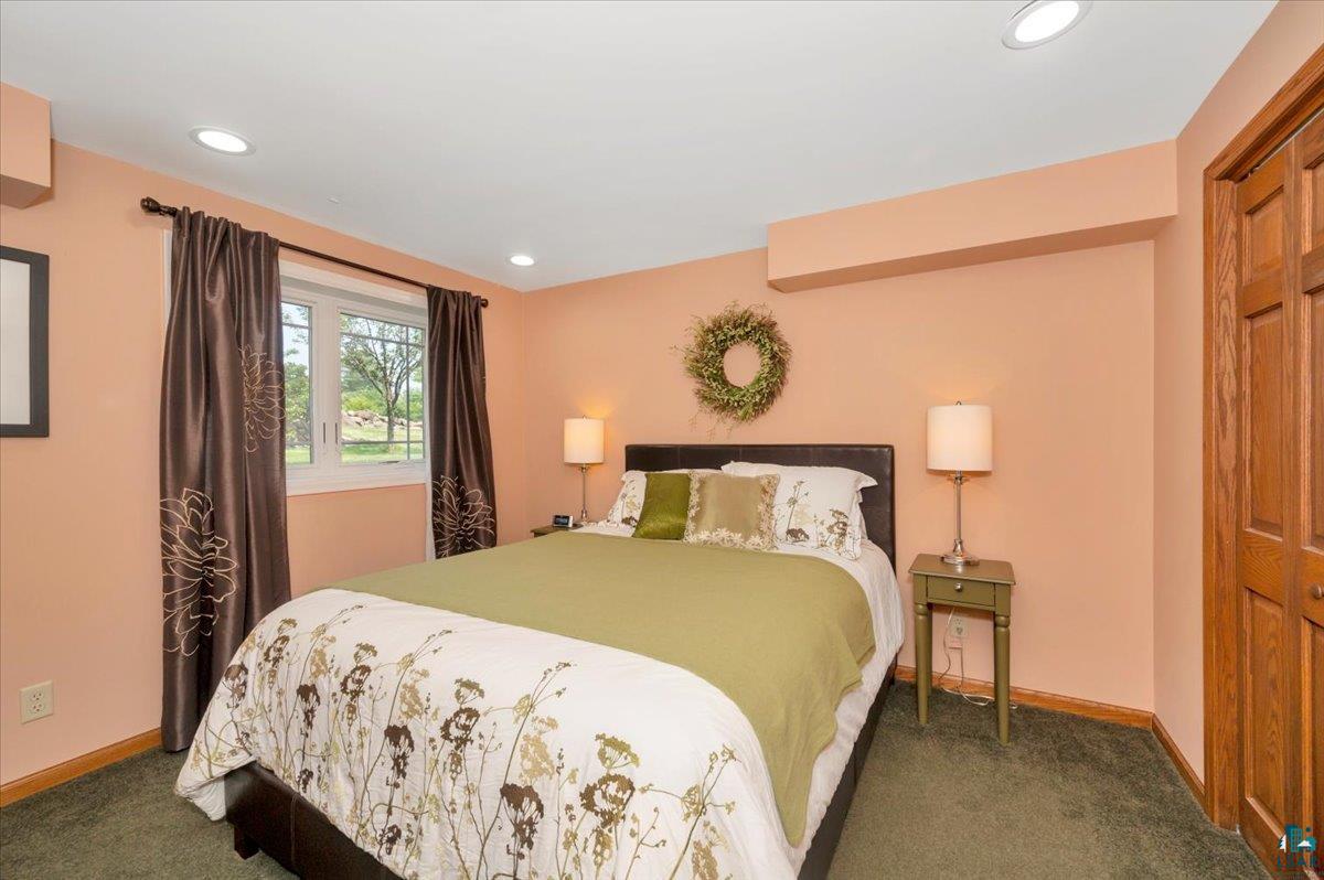 1323 South Ridge Road Duluth, MN 55804 - Photo 16 of 31 Bedroom with a closet and dark colored carpet
